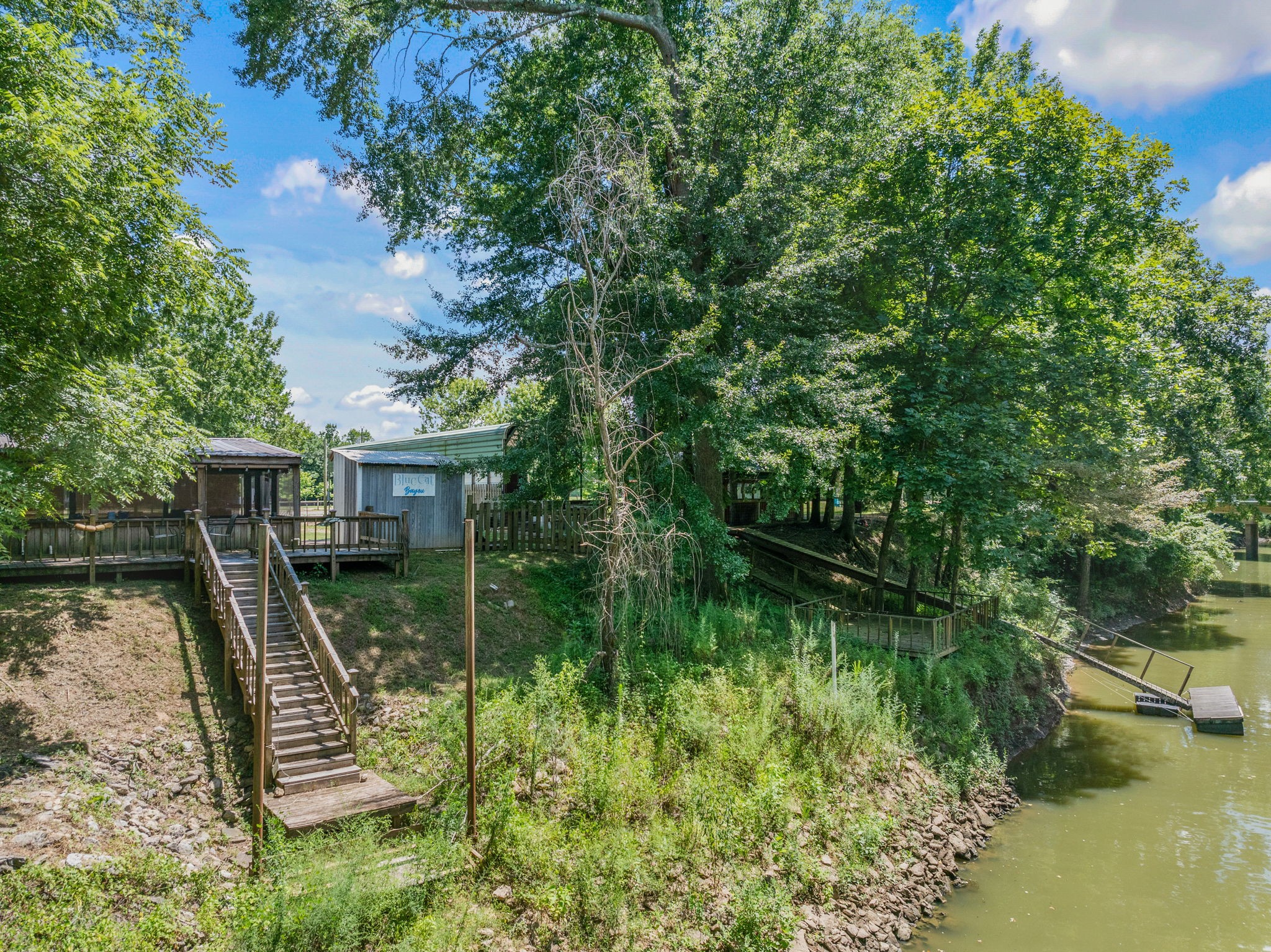 85 Bargeview Lane Adamsville, TN 38310 - Photo 39 of 44 a view of a wooden deck and lake view