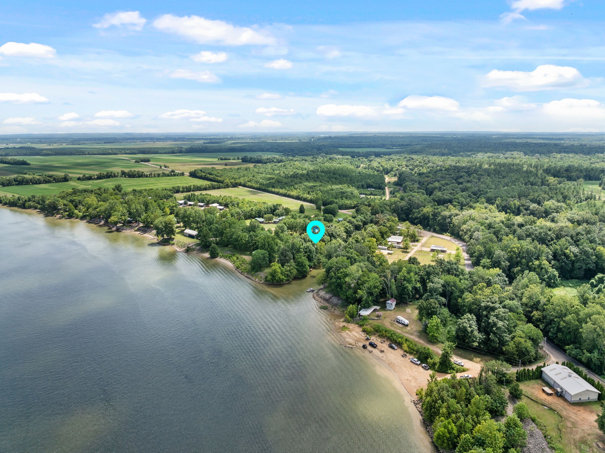 85 Bargeview Lane Adamsville, TN 38310 - Photo 43 of 44 an aerial view of a houses with outdoor space and street view