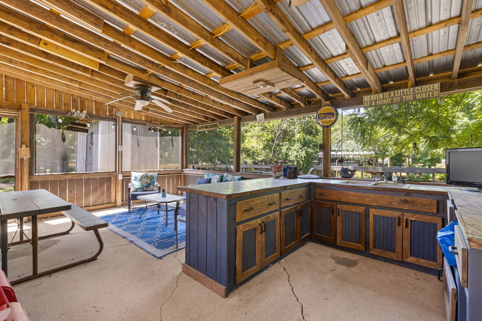 85 Bargeview Lane Adamsville, TN 38310 - Photo 6 of 44 a open kitchen with stainless steel appliances granite countertop a sink and wooden cabinets