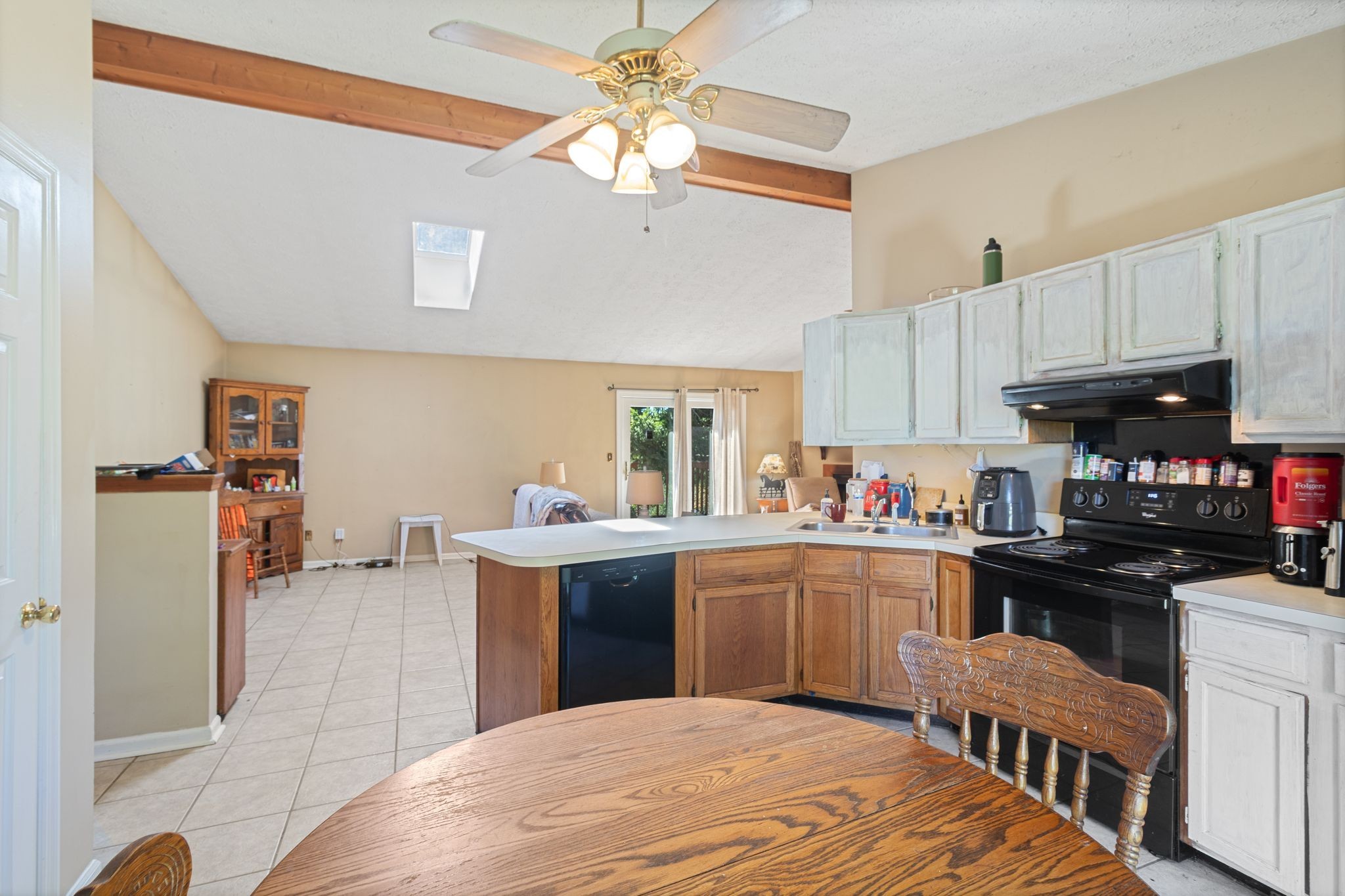 10373 Spanntown Road Arrington, TN 37014 - Photo 15 of 23 a kitchen with stainless steel appliances a sink a stove a refrigerator cabinets and living room view