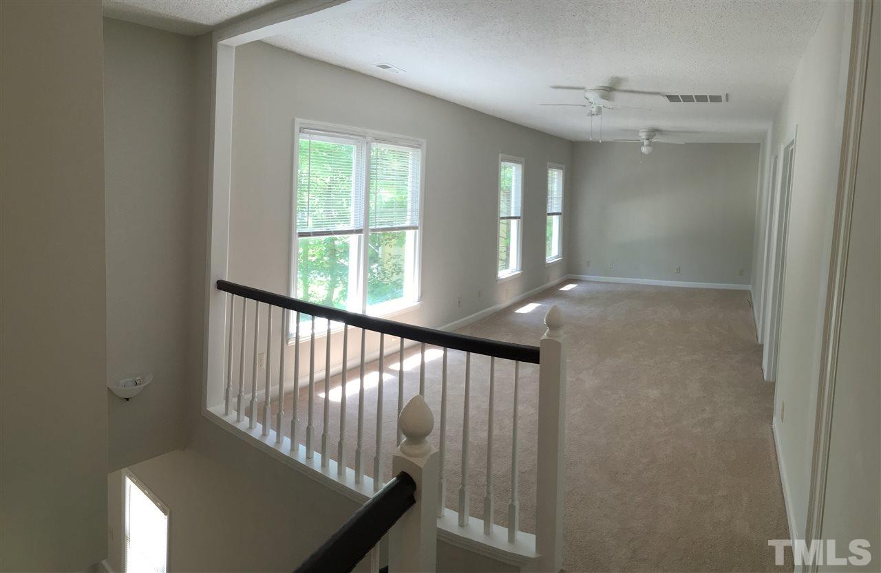 4821 Knightsbridge Way Raleigh, NC 27604 - Photo 13 of 22 a view of a hallway with windows