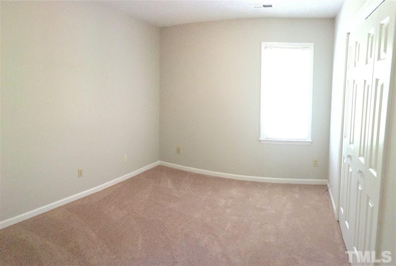 4821 Knightsbridge Way Raleigh, NC 27604 - Photo 16 of 22 an empty room with a window