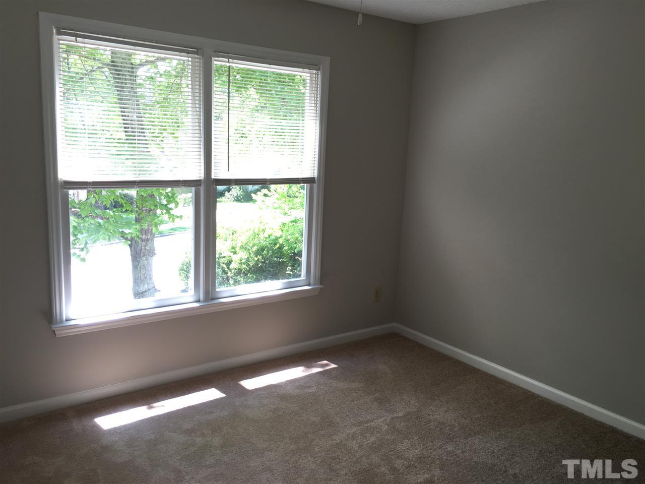 4821 Knightsbridge Way Raleigh, NC 27604 - Photo 17 of 22 an empty room with a window