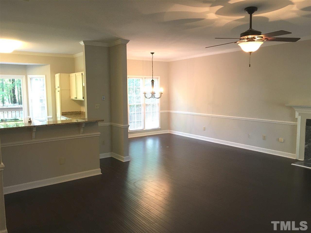 4821 Knightsbridge Way Raleigh, NC 27604 - Photo 3 of 22 an empty room with wooden floor and windows