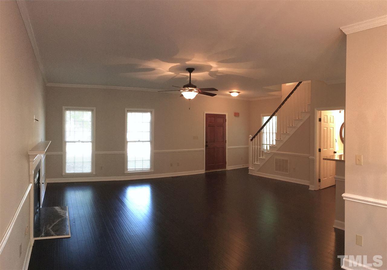 4821 Knightsbridge Way Raleigh, NC 27604 - Photo 4 of 22 an empty room with wooden floor and windows