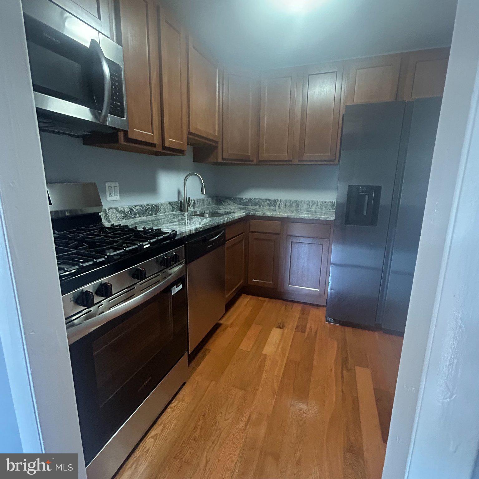 10549 Twin Rivers Road, Unit E1 Columbia, MD 21044 - Photo 3 of 20 Modern kitchen with sleek finishes.