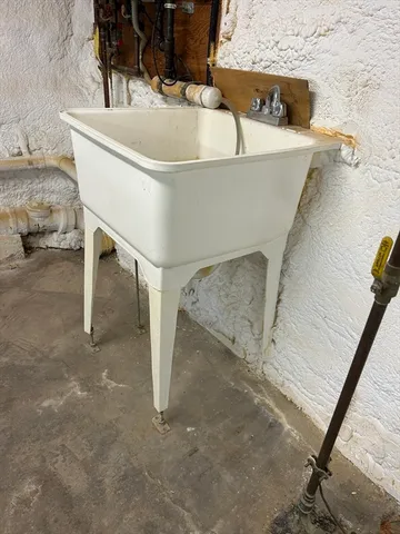 a white bath tub sitting in a bathroom