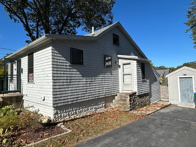 a front view of a house with a garage