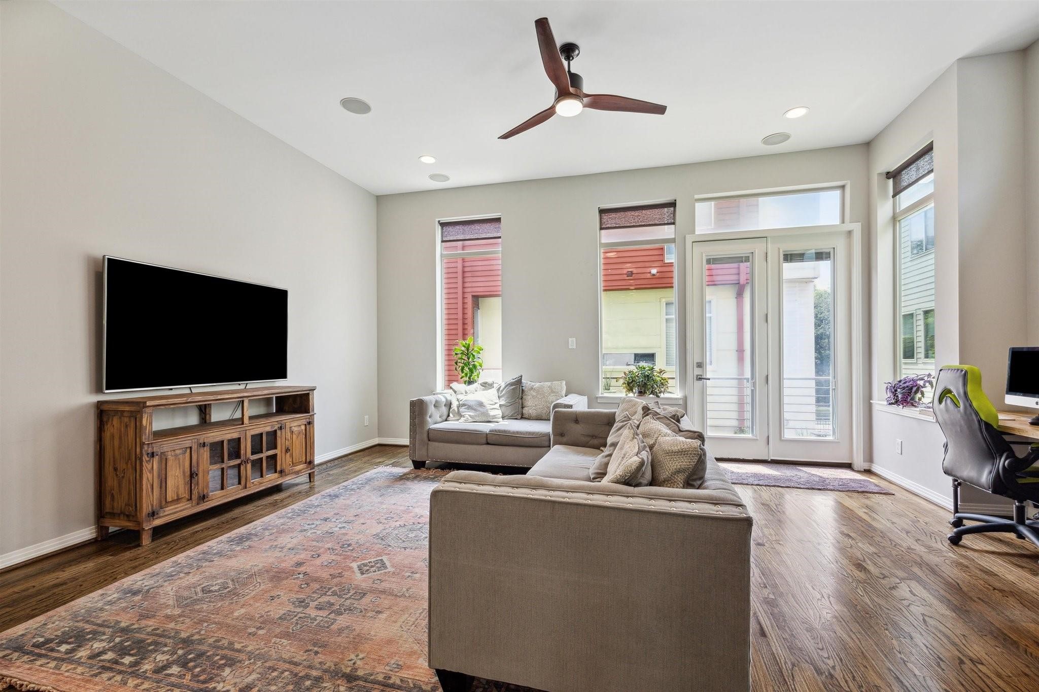 1630 Dennis Street Houston, TX 77004 - Photo 11 of 33 a living room with furniture and a flat screen tv