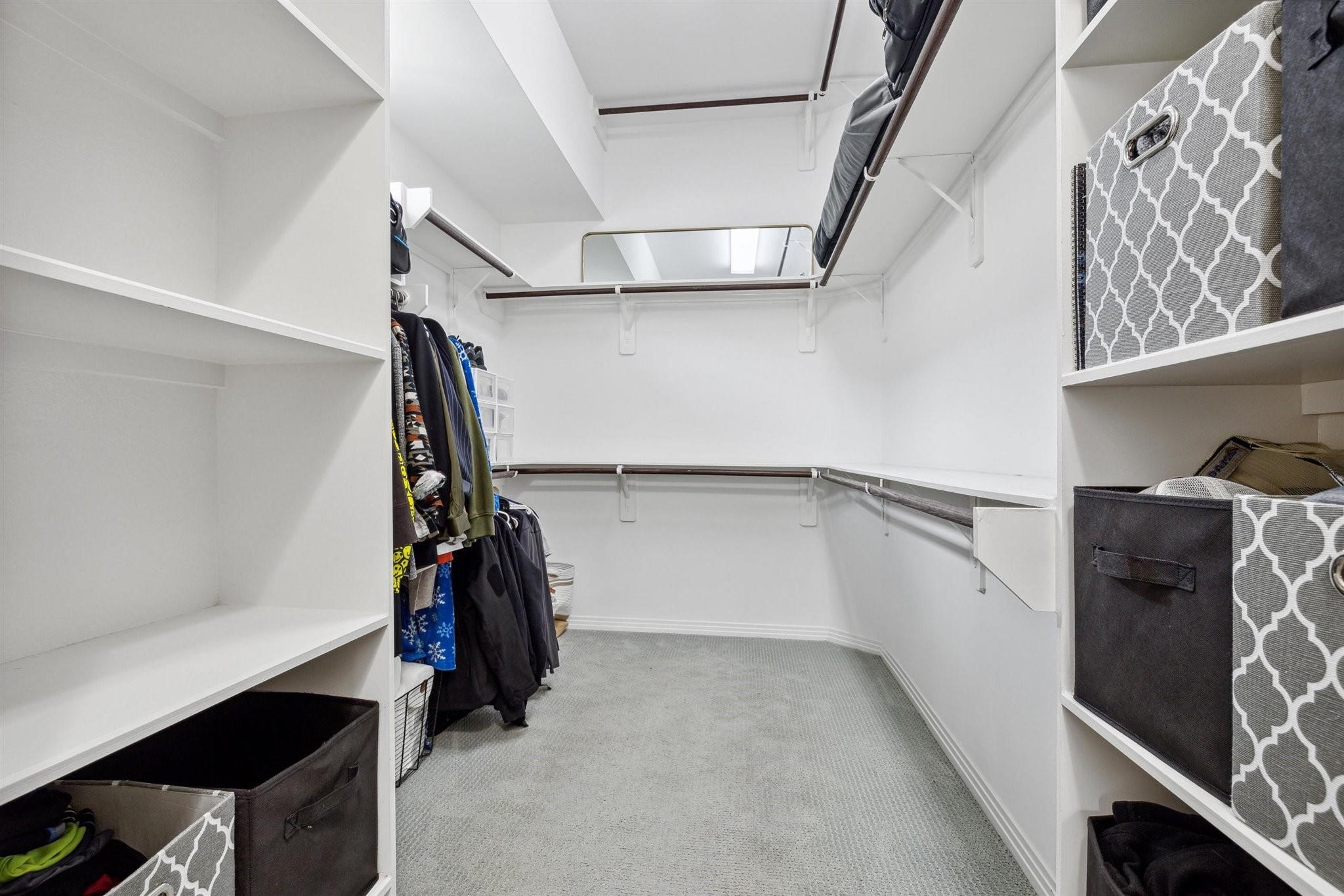 1630 Dennis Street Houston, TX 77004 - Photo 27 of 33 a view of walk in closet with clothes and shoes