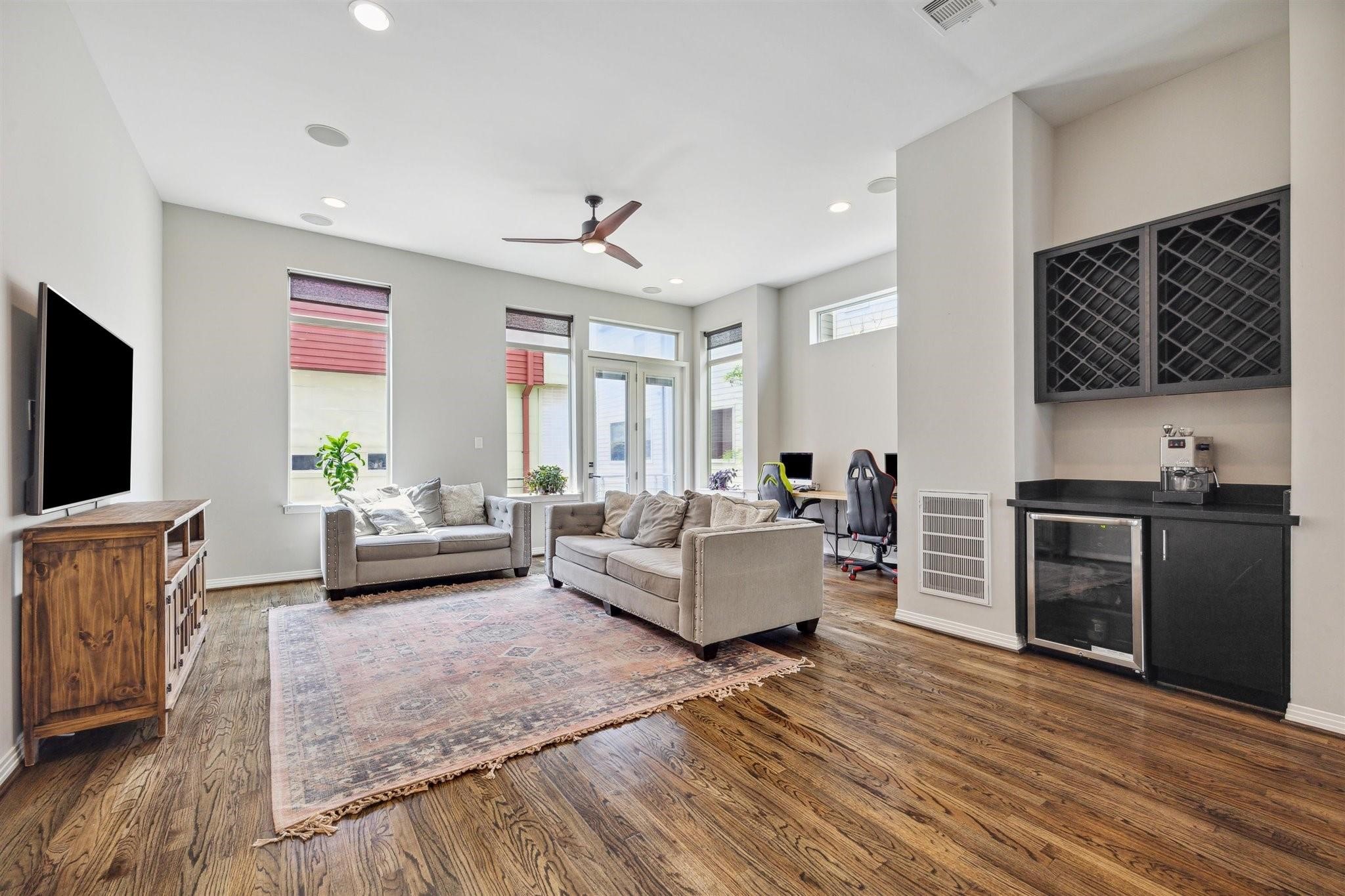 1630 Dennis Street Houston, TX 77004 - Photo 10 of 33 a living room with furniture and a flat screen tv