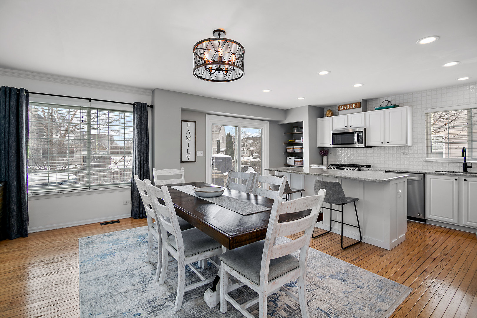 1675 Rosehall Lane Elgin, IL 60123 - Photo 13 of 49 a view of a dining room with furniture window and wooden floor