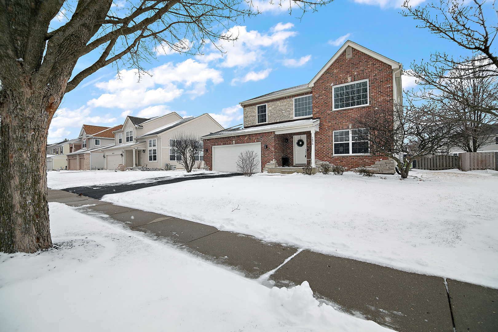 1675 Rosehall Lane Elgin, IL 60123 - Photo 2 of 49 a street view with residential house