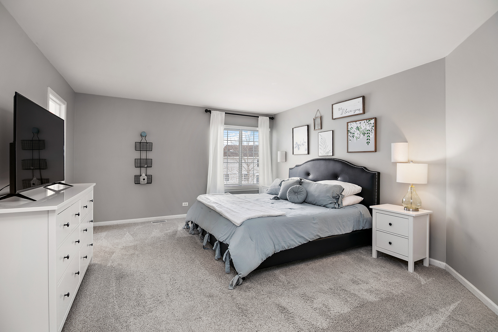 1675 Rosehall Lane Elgin, IL 60123 - Photo 23 of 49 a bedroom with a bed and a flat screen tv