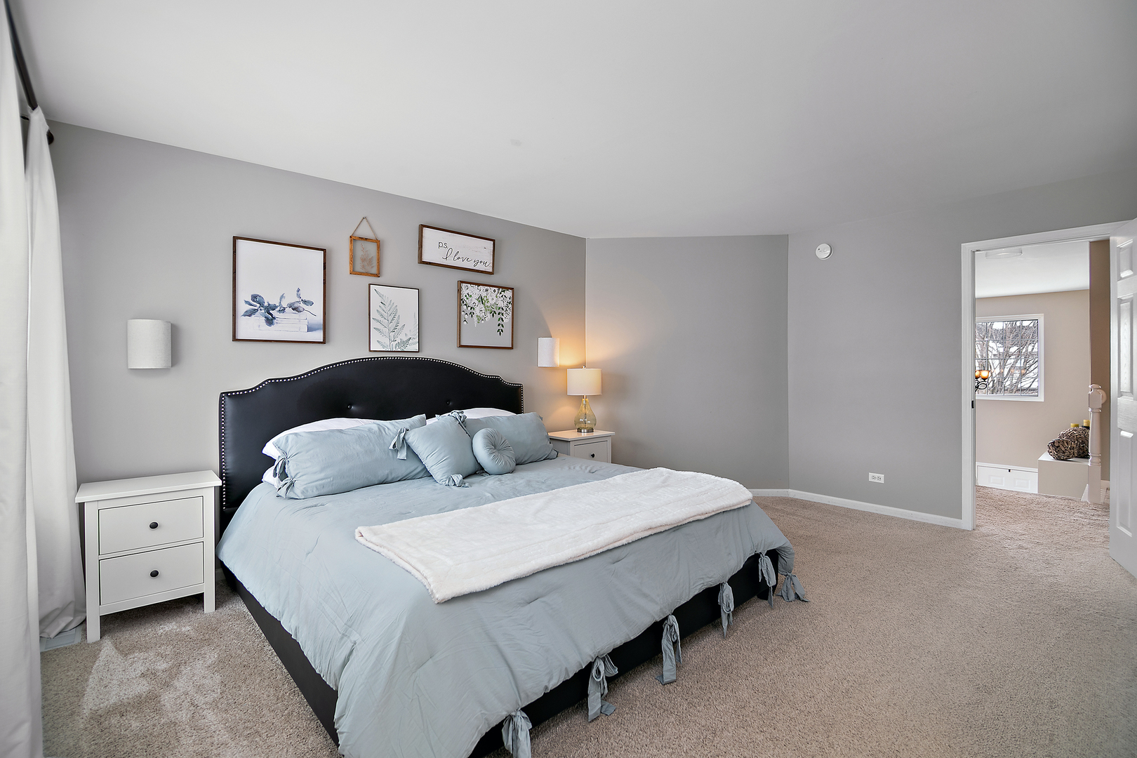 1675 Rosehall Lane Elgin, IL 60123 - Photo 24 of 49 a bedroom with a bed and painting on the wall