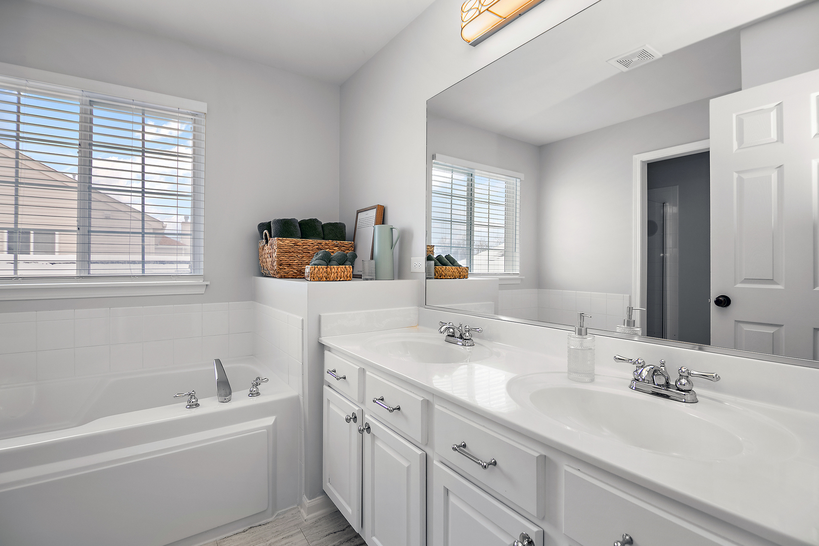 1675 Rosehall Lane Elgin, IL 60123 - Photo 26 of 49 a bathroom with a sink double vanity granite tub and a mirror