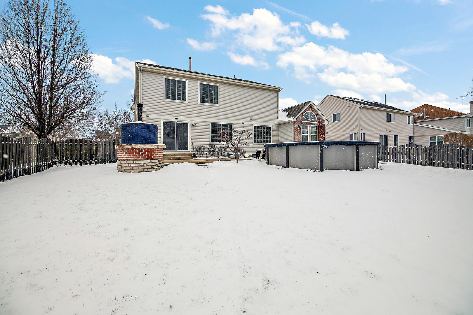 1675 Rosehall Lane Elgin, IL 60123 - Photo 40 of 49 a view of a house with snow on the roof