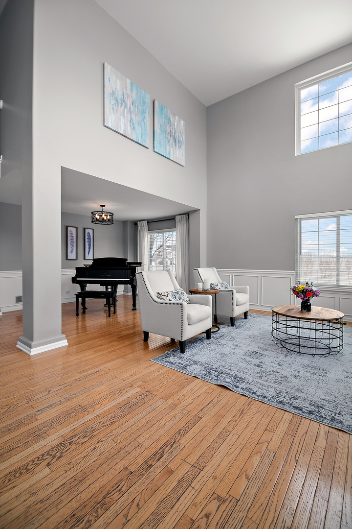 1675 Rosehall Lane Elgin, IL 60123 - Photo 4 of 49 a living room with furniture and a wooden floor