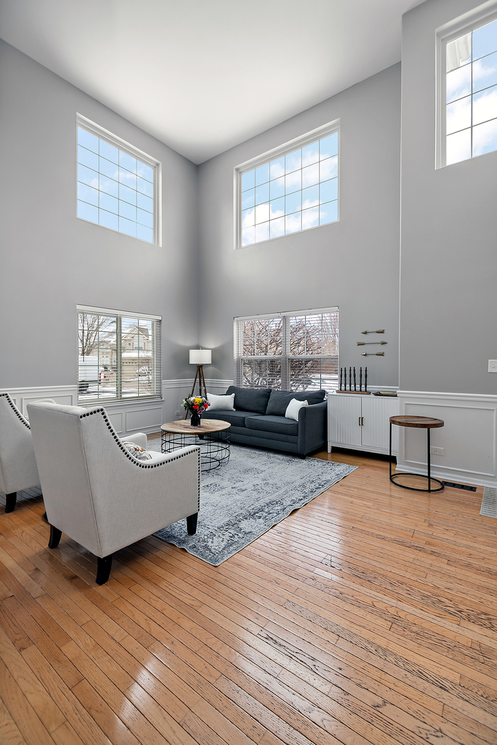 1675 Rosehall Lane Elgin, IL 60123 - Photo 5 of 49 a living room with furniture and a wooden floor