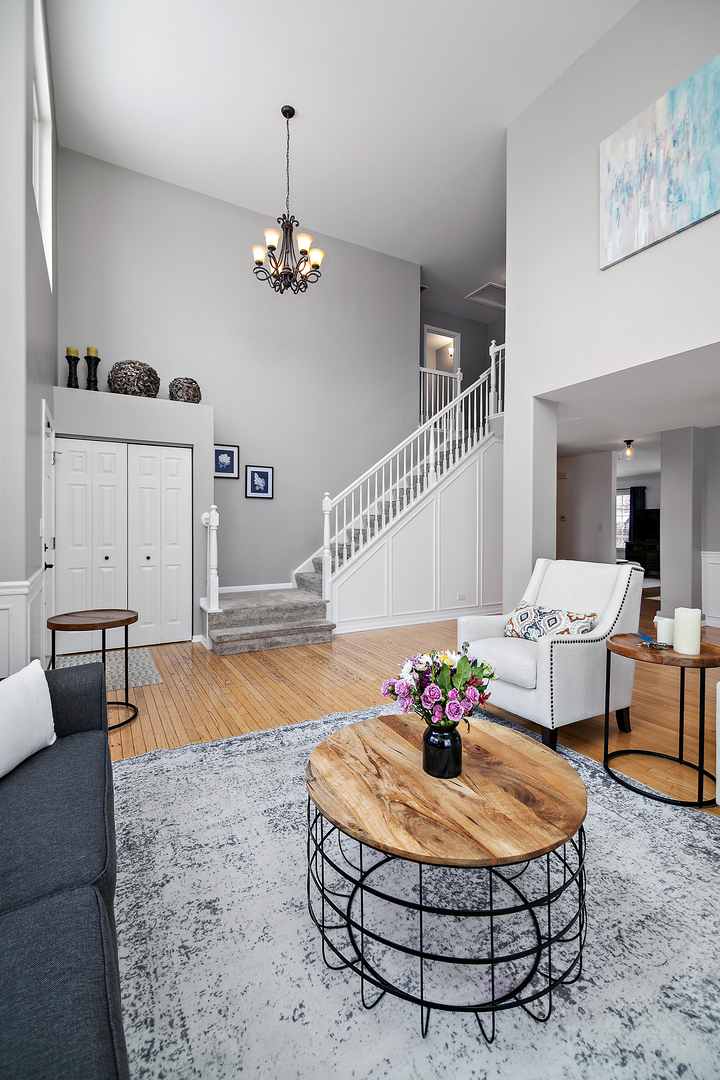 1675 Rosehall Lane Elgin, IL 60123 - Photo 6 of 49 a living room with furniture and a chandelier