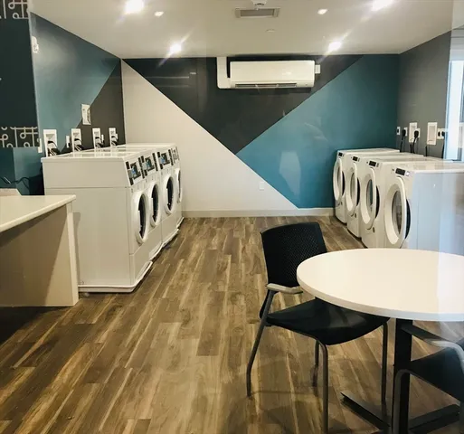 a room with gym equipment and a flat screen tv