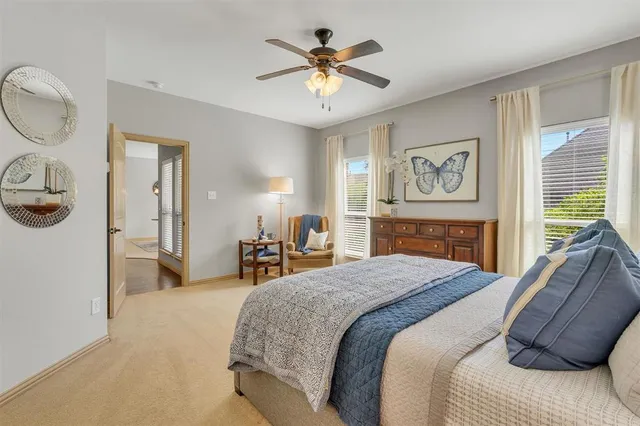 a kitchen with white cabinets and a sink