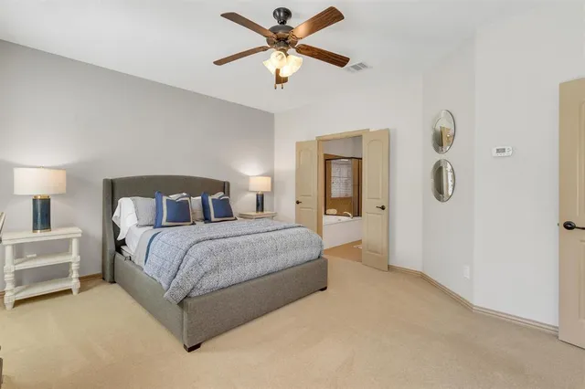 a bedroom with a bed dresser and a window