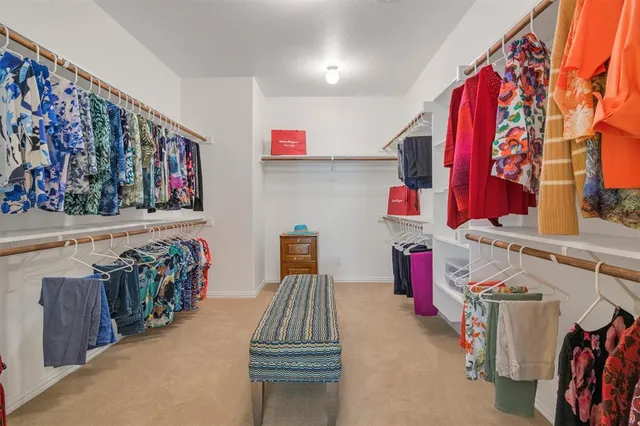a en suite bathroom with a sink and a large mirror