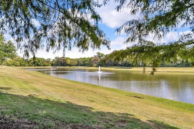 a backyard of a house with yard and outdoor seating
