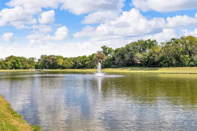 a view of a lake with trees