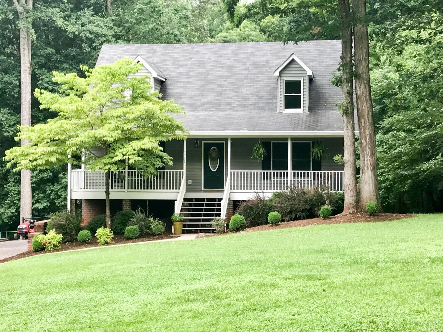 4512 Roaring Run Road Goode, VA 24556 - Photo 1 of 54 a front view of a house with a yard and potted plants