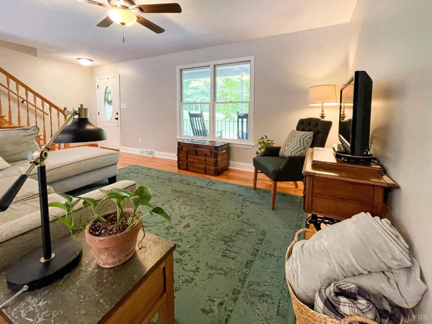 4512 Roaring Run Road Goode, VA 24556 - Photo 11 of 54 a living room with furniture and a window