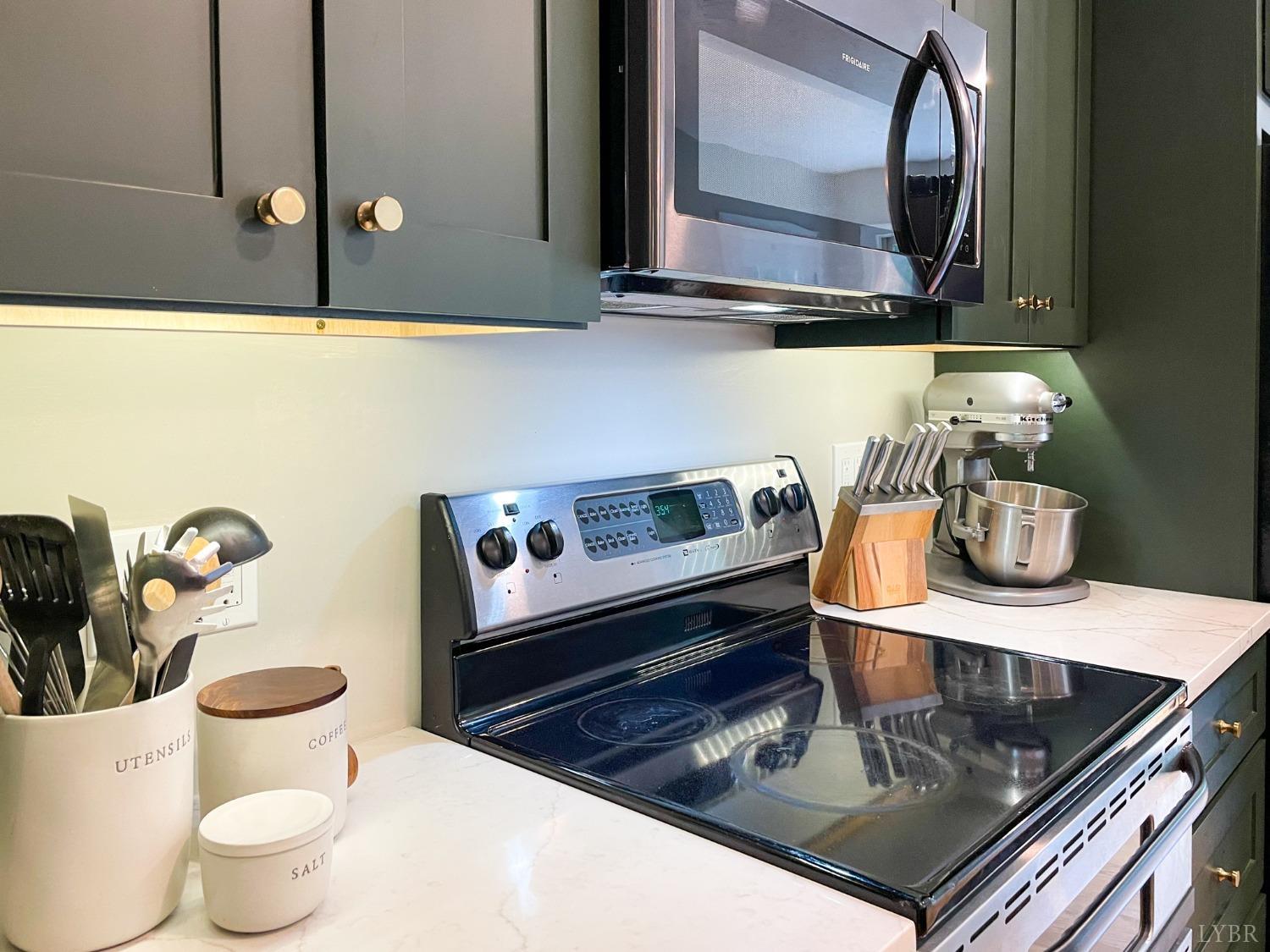 4512 Roaring Run Road Goode, VA 24556 - Photo 15 of 54 a kitchen with a stove and a microwave