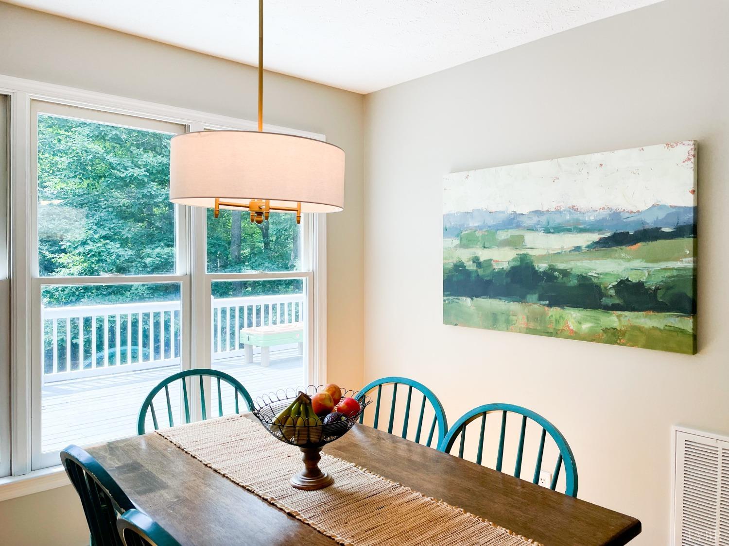 4512 Roaring Run Road Goode, VA 24556 - Photo 19 of 54 a view of a dining room with furniture window and wooden floor