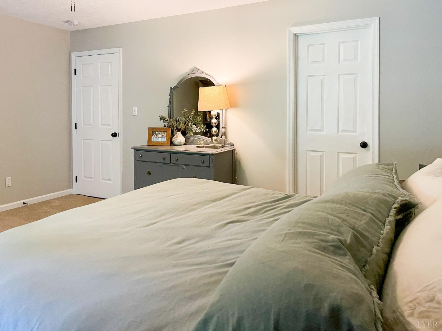 4512 Roaring Run Road Goode, VA 24556 - Photo 26 of 54 a bedroom with a bed and a dresser