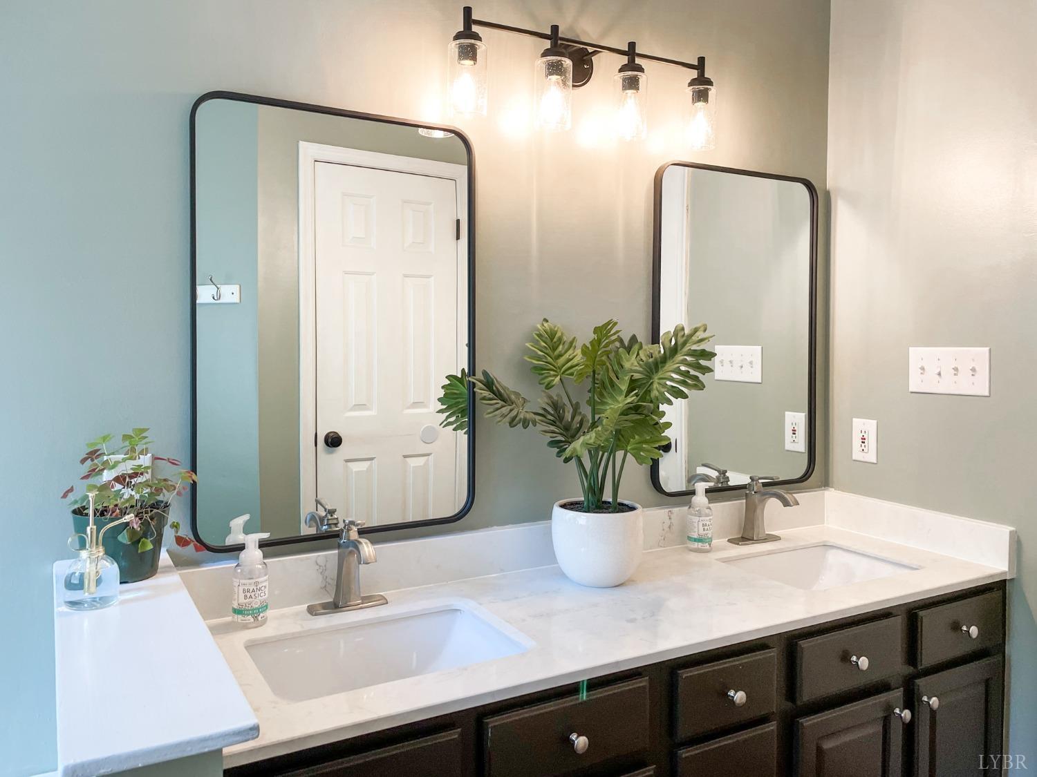 4512 Roaring Run Road Goode, VA 24556 - Photo 29 of 54 a bathroom with a sink a vanity and a mirror