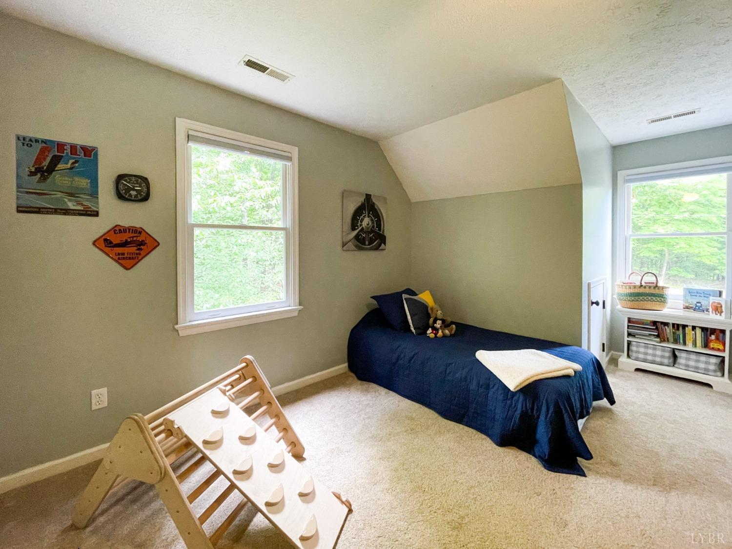 4512 Roaring Run Road Goode, VA 24556 - Photo 34 of 54 a bedroom with a bed and a window