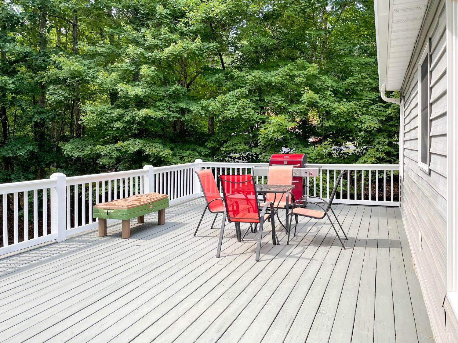4512 Roaring Run Road Goode, VA 24556 - Photo 44 of 54 a view of a deck with furniture and wooden floor