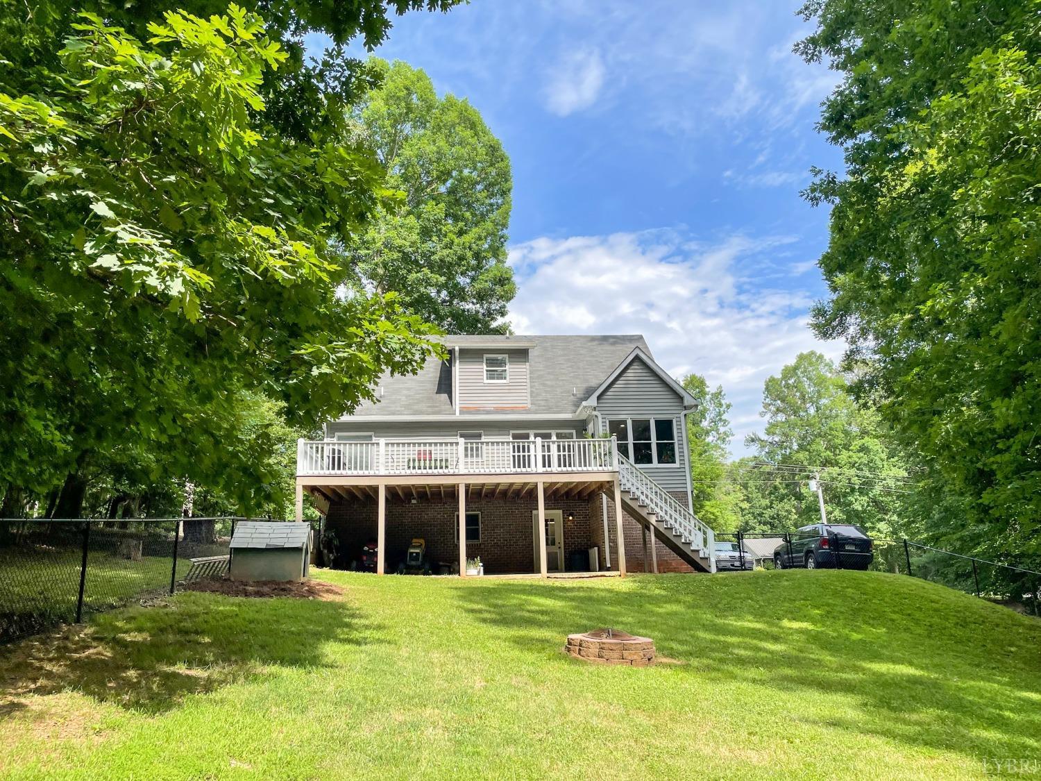 4512 Roaring Run Road Goode, VA 24556 - Photo 46 of 54 a front view of a house with a garden