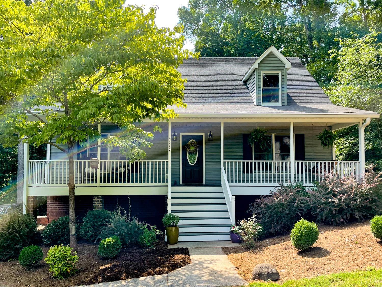 4512 Roaring Run Road Goode, VA 24556 - Photo 51 of 54 a front view of a house with a garden