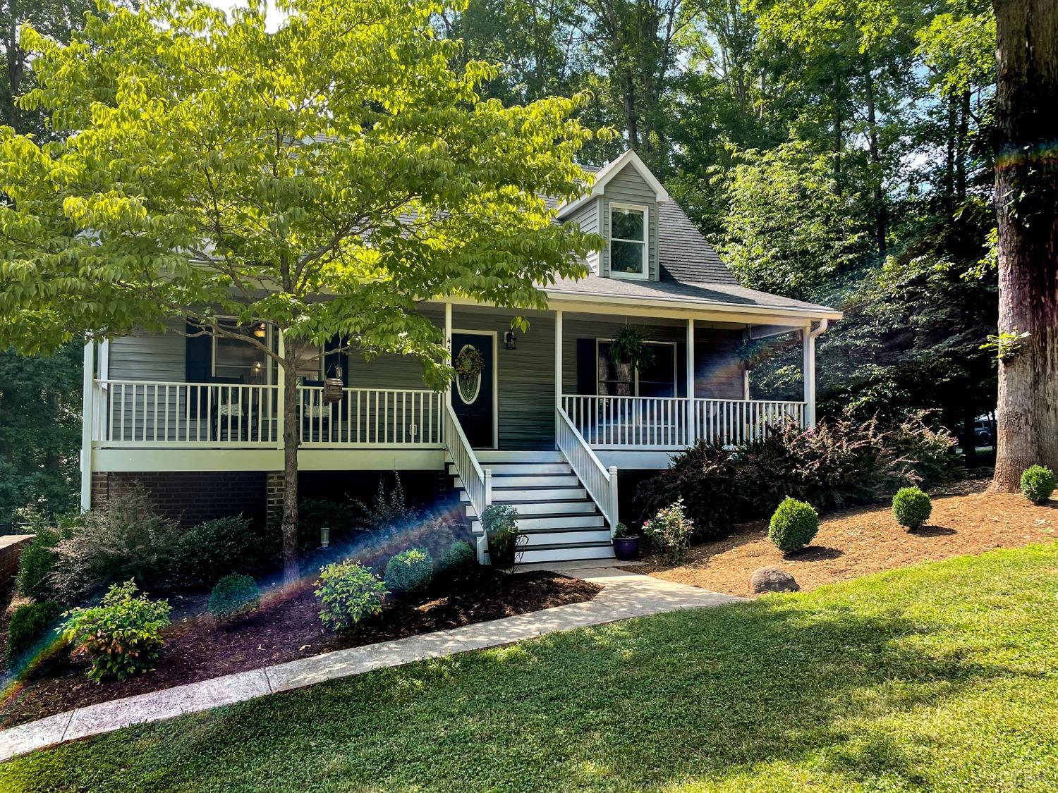 4512 Roaring Run Road Goode, VA 24556 - Photo 52 of 54 a front view of a house with a yard patio and fire pit