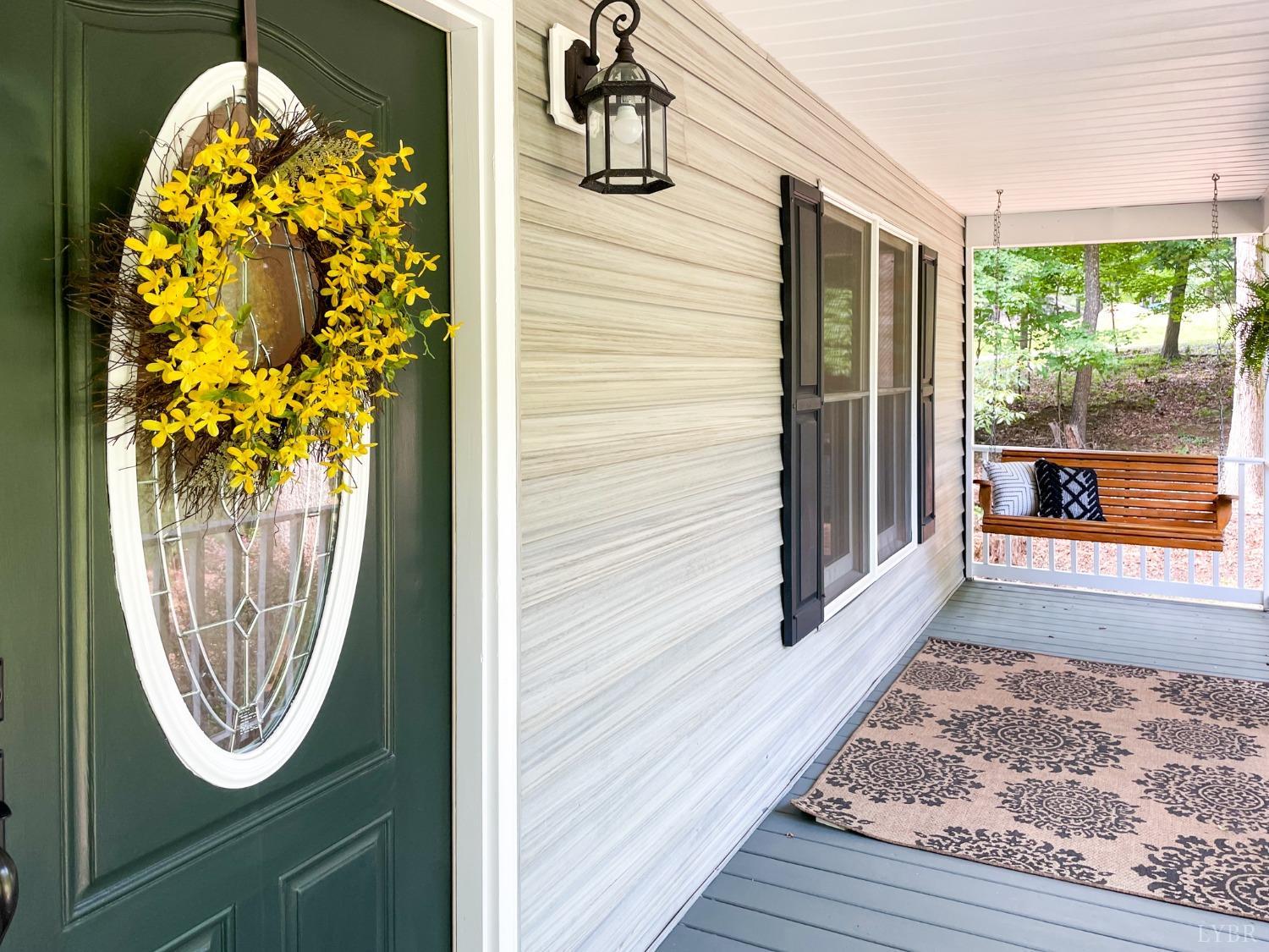 4512 Roaring Run Road Goode, VA 24556 - Photo 7 of 54 a view of a entryway door with wooden floor