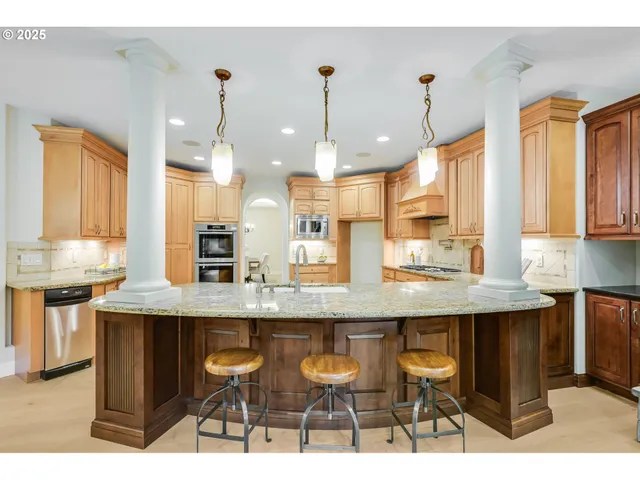 a living room with fireplace furniture and a wooden floor