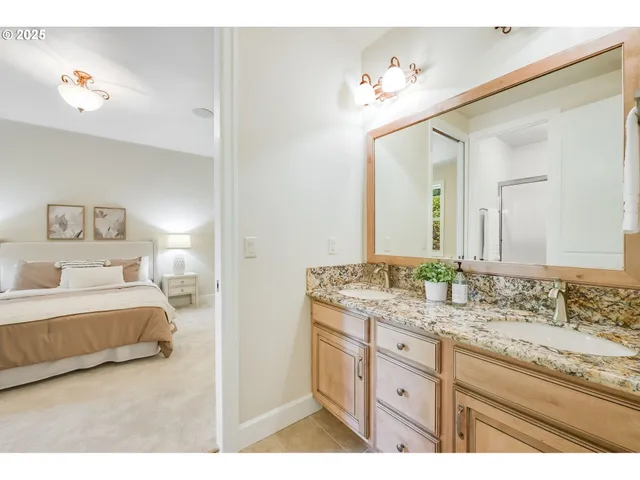 a bedroom with a bed and a night stand