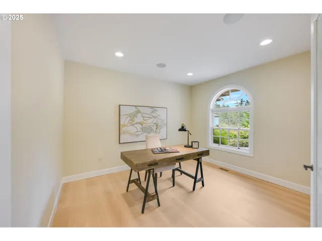 a workspace with furniture and window