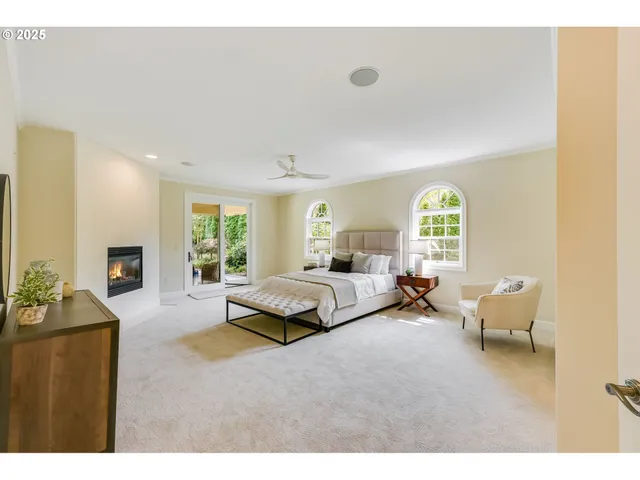 a bedroom with furniture and a window