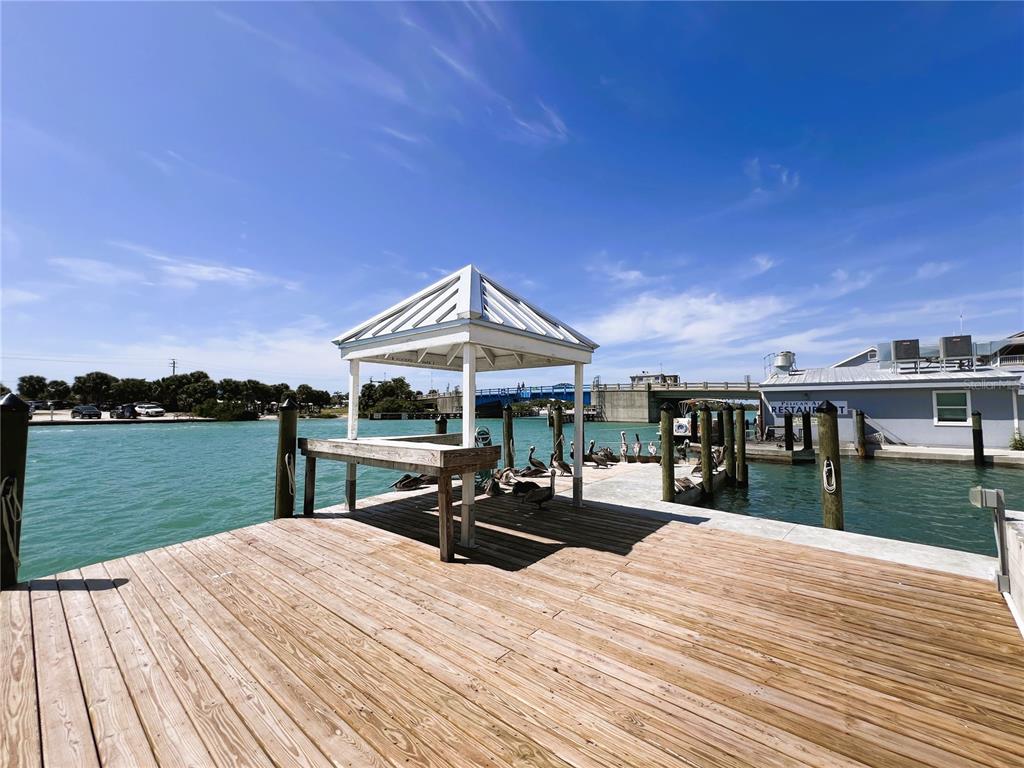 100 Circuit Road, Unit S71 Nokomis, FL 34275 - Photo 11 of 19 a wooden deck with sunset view