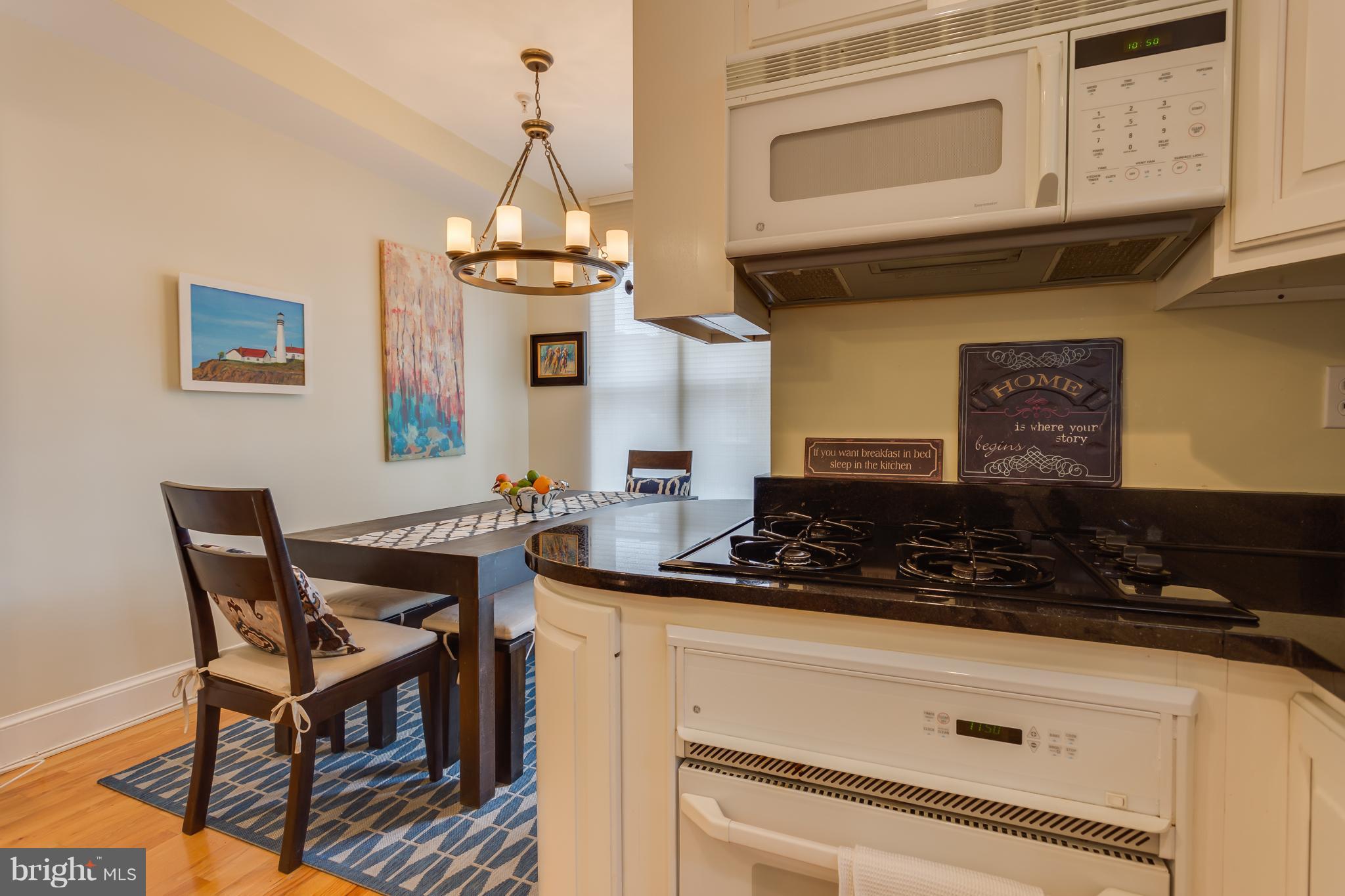 1603 16th Street Northwest, Unit 3 Washington, DC 20009 - Photo 11 of 30 a kitchen with a stove and cabinets