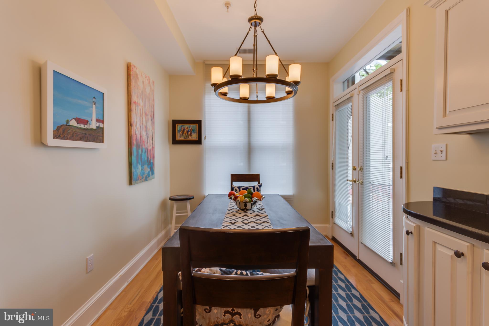 1603 16th Street Northwest, Unit 3 Washington, DC 20009 - Photo 13 of 30 a view of a dining room with a table and chairs