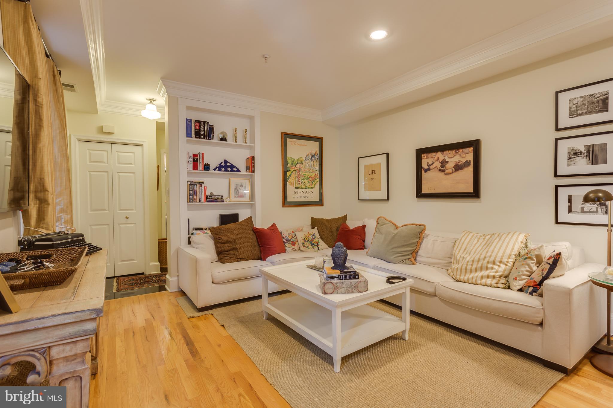 1603 16th Street Northwest, Unit 3 Washington, DC 20009 - Photo 14 of 30 a living room with furniture and a flat screen tv
